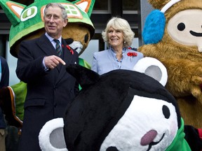 Their Royal Highness, Charles, The Prince of Wales and Camilla, Duchess of Cornwall, pose for a photo with Olympic Mascots Miga, Quatchi, and Sumi before entering the Salt Building at the 2010 Olympic and Paralympic Village in Vancouver as part of there royal visit to Canada, Nov. 7, 2009.