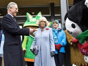 Charles, The Prince of Wales shares a moment with Olympic Mascot Miga as Camilla, Duchess of Cornwall looks on before entering the Salt Building at the 2010 Olympic and Paralympic Village in Vancouver as part of there royal visit to Canada, Nov. 7, 2009.