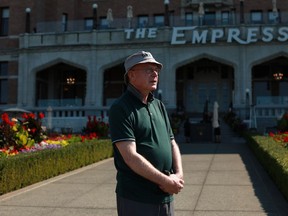 William Morris, a tourist from the United Kingdom, is photographed outside the Fairmont Empress in Victoria, Friday, Sept. 9, 2022, a day after the death of Queen Elizabeth II.
