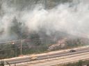 Smoke from a wildfire west of Hope, B.C. is shown over Highway 1 in a Sept.11, 2022 handout photo. Air quality improved slightly over Metro Vancouver but remains at very unhealthy levels in several other regions as wildfire smoke blankets large sections of British Columbia. THE CANADIAN PRESS/HO-BC Wildfire Service **MANDATORY CREDIT**