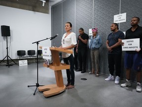 Chris Amyotte's cousin, Samantha Wilson, delivers a statement in front of (from left) Amyotte's brother Isaac Ndlovu, wife Amanda Cook, and brothers Michael Ndlovu and Richard Ndlovu during a news conference in Vancouver, B.C., Thursday, Sept. 1, 2022. Amyotte, an Ojibway man from Manitoba, died after he was shot by Vancouver police with a beanbag gun in the Downtown Eastside last month.