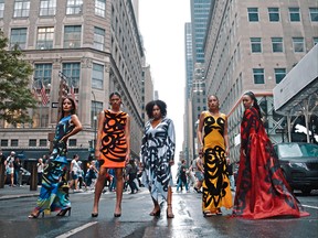 Fashion models wear couture garments by Indigenous-owned brand Ay Lelum during New York Fashion Week.