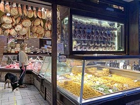 A bodega in Bologna selling ham, cheese and fresh pasta.