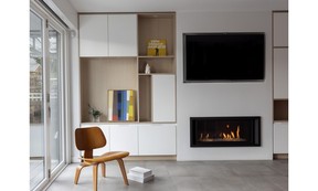 This sitting area at the back of the home centres around the family's Eames moulded plywood chair; a perfect spot to sip coffee, bathed in natural light from new sliding-glass doors to the backyard.