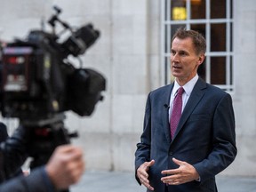 Chancellor of the Exchequer, Jeremy Hunt, takes part in a TV interview outside BBC Broadcasting House on Oct. 15.