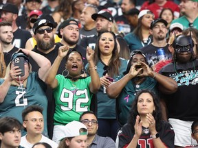 Fans cheer during the second half of the NFL game between the Arizona Cardinals and the Philadelphia Eagles at State Farm Stadium on Oct. 9, 2022 in Glendale, Arizona. The Eagles defeated the Cardinals 20-17. Photo: Christian Petersen/Getty Images