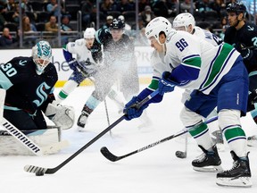Andrei Kuzmenko #96 of the Vancouver Canucks looks to shoot against Seattle Kraken during the first period at Climate Pledge Arena on October 27, 2022 in Seattle, Washington.