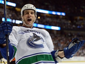 Aaron Volpatti celebrates one of his three goals in Canucks colours, this one against the Anaheim Ducks in a January 2013 NHL game at the Honda Center in Anaheim, Calif.