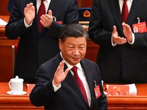 China's President Xi Jinping arrives for the opening session of the 20th Chinese Communist Party's Congress at the Great Hall of the People in Beijing on October 16, 2022. (Photo by Noel CELIS / AFP)