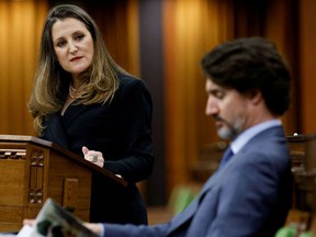 Deputy Prime Minister and Finance Minister Chrystia Freeland looks at Prime Minister Justin Trudeau as she delivers the budget in the House of Commons in a file photo from April 19, 2021.