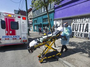 File photo of paramedics helping a person who has overdosed from B.C.'s toxic illegal drug supply.