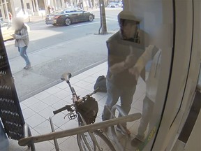 Vancouver police released this security video showing a suspect threatening another man with a knife just after noon on Oct. 15, 2022. Police are appealing to the victim to come forward.