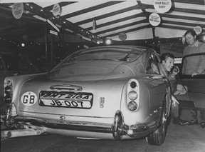 November 1969. Restaurant owner Frank Baker and his James Bond Aston Martin. Other person in photo is Kenneth Luscombe-White. George Diack / Vancouver Sun