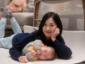 Cindy Li and her son Ethan Liang pose in this undated handout photo. Cindy Li was so grateful for donated breast milk when her premature son needed it that she decided to donate some to help other babies.