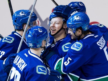 Vancouver Canucks #41 Ronalds Kenins ( C ) celebrates his goal on the  Calgary Flames with teammates #53 Bo Horvat, #36 Jannik Hansen, #5 Luca Sbisa and #3 Kevin Bieksa in the third period of the Game 2 of the Western Conference quarter final of the NHL Stanley Cup playoffs at Rogers Arena, Vancouver April 17 2015.