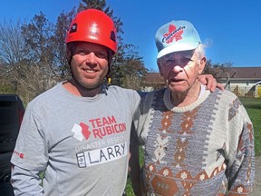 Chief Larry Watkinson of the Penticton Fire Department doing relief work in Nova Scotia with Charlie, 91, whose home was badly damaged by Storm Fiona. Courtesy Larry Watkinson