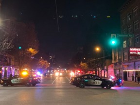 Police cruisers block Main Street north of National Avenue on Thursday night.