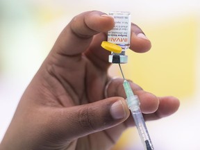 A health-care worker prepares monkeypox vaccine in Montreal on July 23, 2022. Second doses of the monkeypox vaccine will be available to British Columbians starting this week.