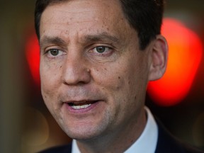 B.C. NDP leadership candidate David Eby responds to questions while speaking with reporters in Vancouver, on Wednesday, October 19, 2022.