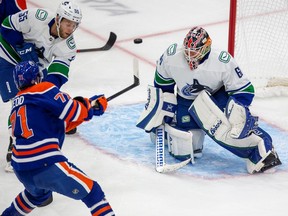 Edmonton Oilers Ryan McLeod shoots the puck by the Vancouver Canucks goalie Collin Delia during first period pre-season action on Monday, Oct. 3, 2022 in Edmonton.