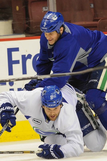 Vancouver Canucks practice at Rogers Arena Wednesday, January 7, 2015. Pictured is Zack Kassian (centre) and Kevin Bieksa (right).