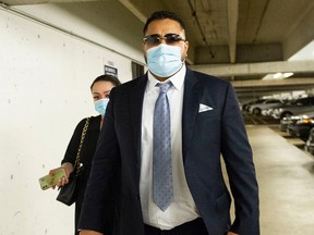 Harjot Deo (in mask) enters BC Supreme Court Wednesday, October 5, 2022 for his sentencing hearing. Deo pleaded guilty to fatally shooting his former girlfriend in August 2017. (Photo by Jason Payne/ PNG)