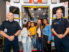 Advanced Care Paramedics Tyler Clements (left) and Laurence Darlington presented the Vital Link award to Siera and Yesica Edstrand with her brother Gunnar and father Hans on hand.