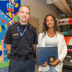 Advanced Care Paramedic Laurence Darlington presents the Vital Link award to Siera Edstrand.