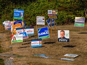 Election signs at David and Johnson streets in Coquitlam on Oct. 13.