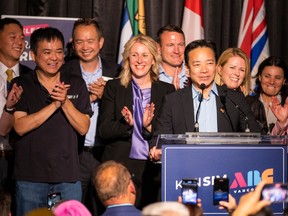Mayor elect Ken Sim is surrounded by ABC Vancouver candidates as he addresses the crowd on Saturday, Oct. 15, 2022.