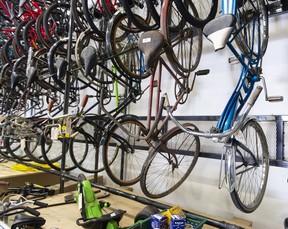 A wall of vintage bicycles being auctioned off.