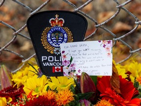 Flowers for fallen RCMP member Const. Shaelyn Yang at at Broadview Park in Burnaby, BC Thursday, October 20, 2022. Const. Yang was killed in the line-of-duty October 18 in Broadview Park while helping a city by-law officer check-on a homeless man living in the park.(Photo by Jason Payne/ PNG)
