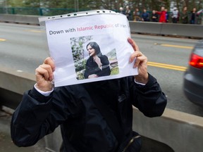 Thousands of people line Stanley Park Causeway and across the Lions Gate Bridge Saturday, October 29, 2022 to take part in the Human Chain for Iran protest.