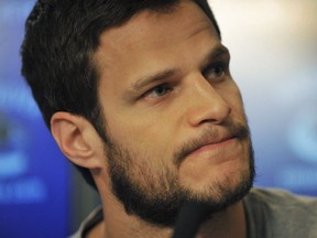 Canucks Kevin Bieksa talks to the media at a press conference in Vancouver on April 27, 2015.
