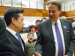Ken Sim’s sons react in the background after Sim won the NPA leadership over John Coupar (right) in 2018.