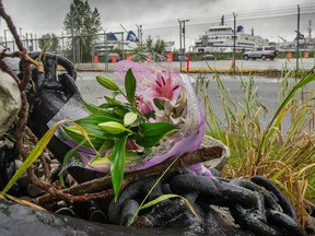 Flowers are seen placed on an anchor outside B.C. Ferries fleet maintenance yard in Richmond after a worker fell from a ramp and drowned in June 2020.