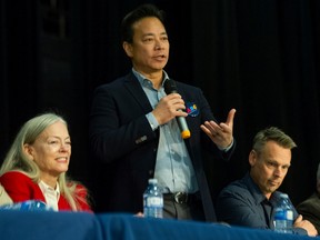 ABC Vancouver mayoral candidate Ken Sim standing between TEAM Vancouver mayoral candidate Colleen Hardwick and ABC Vancouver council candidate Brian Montague.