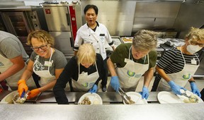 Thanksgiving dinner is served up at Union Gospel Mission in Vancouver on Monday. Photo: Arlen Redekop