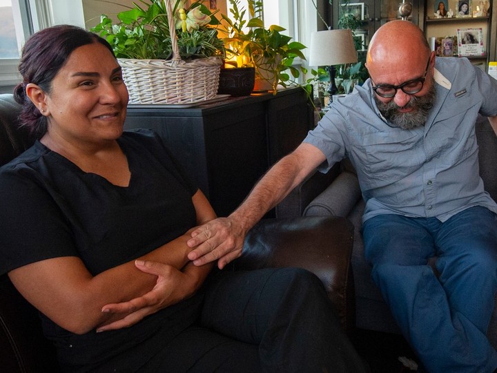  Ramin Abdollahi (right) comforts Roya Ghahramani during an emotional interview about the overdose death of their daughter Sufia Abdollahi, 16. Photo: Arlen Redekop