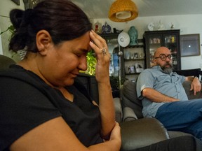 Roya Ghahramani cries as Ramin Abdollahi discusses the overdose death of their daughter Sufia Abdollahi, 16. Photo: Arlen Redekop