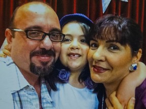 Sufia Abdollahi (centre), with her father Ramin Abdollahi and mother Roya Ghahramani in this undated family photo.