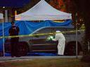Police investigate after two bodies were found on Alpha Avenue near Venables Street in Burnaby on Oct. 17, 2022.