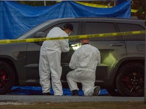 Police investigate after two bodies were found at Venables and Alpha in Burnaby, October 17, 2022.