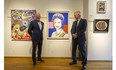 David and Robert Heffel stand beside  an Andy Warhol silkscreen print of Queen Elizabeth at their gallery at Granville and 7th in Vancouver.