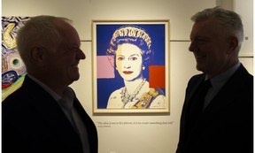 David and Robert Heffel flank a portrait of Queen Elizabeth's Andy Warhol for sale at the Heffel Gallery.