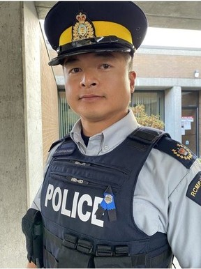 Staff Sgt. Major David Douangchanh wears a blue ribbon above his heart at the BC RCMP press conference following the killing of Burnaby RCMP officer Cst. Shaelyn Yang.