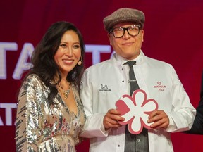 Emcee Mijune Pak with Joel Watanabe, executive chef of Kissa Tanto, after the restaurant was awarded a star at the Michelin Guide awards in Vancouver last week.
