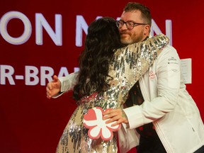 Emcee Mijune Pak gives Gus Stieffenhofer-Brandson, executive chef of Published on Main a congratulatory hug at the Michelin Guide awards at Vancouver Trade and Convention Centre West last week.