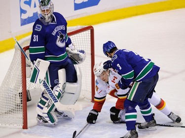 Calgary Flames
Vancouver    B.C.  April 15, 2015  Vancouver Canucks Kevin Bieksa 3,  battles the Calgary Flamers Markus Granlund 60, in Rogers Arena in game 1 of the Stanley Cup, in Vancouver  on April 15, 2015.