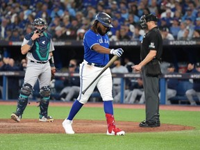 Toronto Blue Jays first baseman Vladimir Guerrero Jr. (27) walks back to the dugout after striking out against the Seattle Mariners during sixth inning American League wild card MLB post-season baseball action in Toronto on Friday, Oct. 7, 2022.